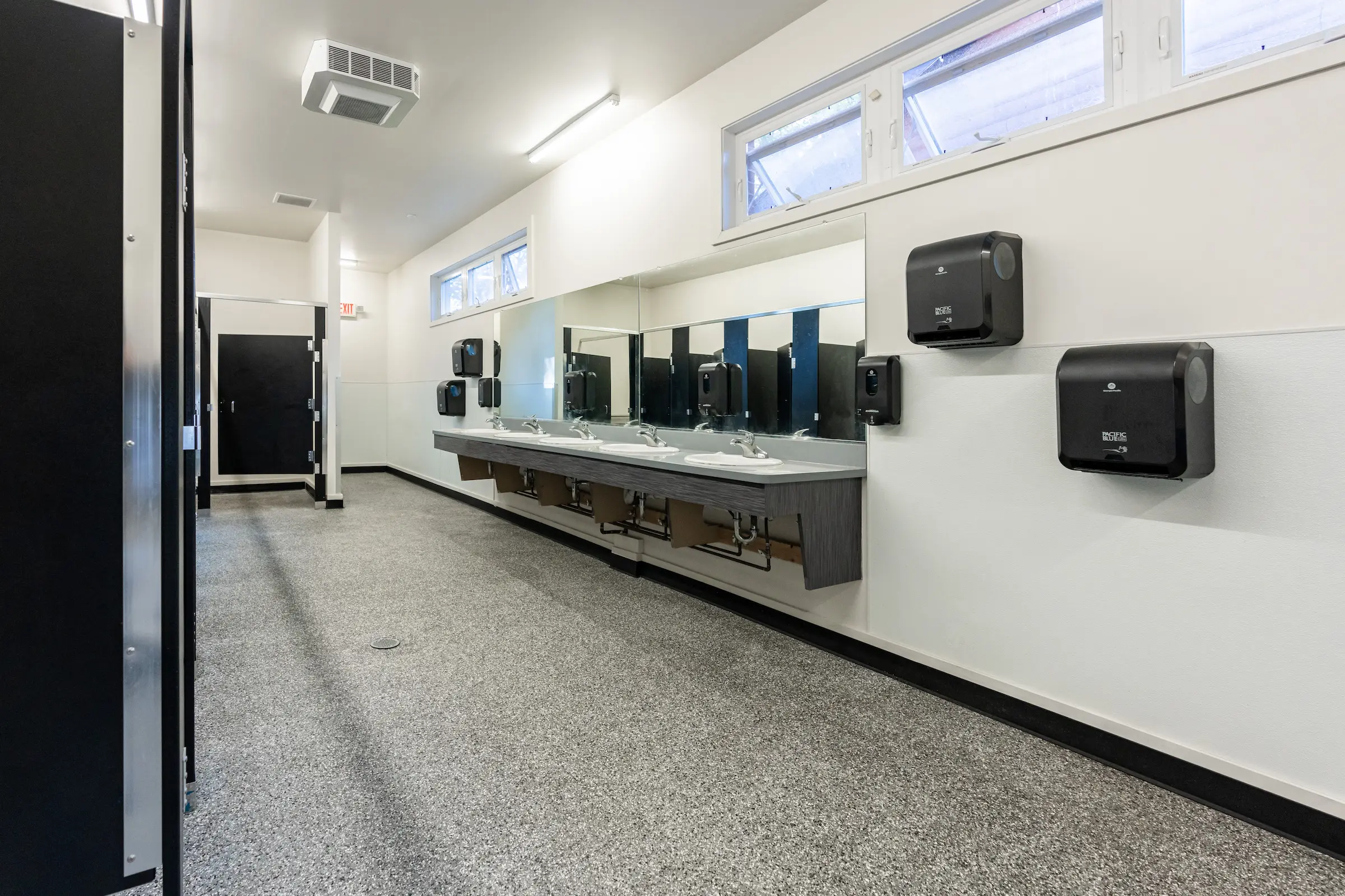 Resurfaced bathroom flooring with a seamless, easy-to-clean epoxy coating for lasting protection and style.